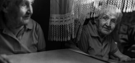 Elderly woman looking at her reflection